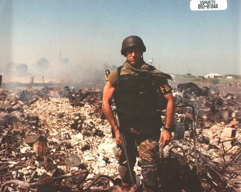 ATF agents pose in the ruins of the Branch Davidian compound, Waco, Texas.