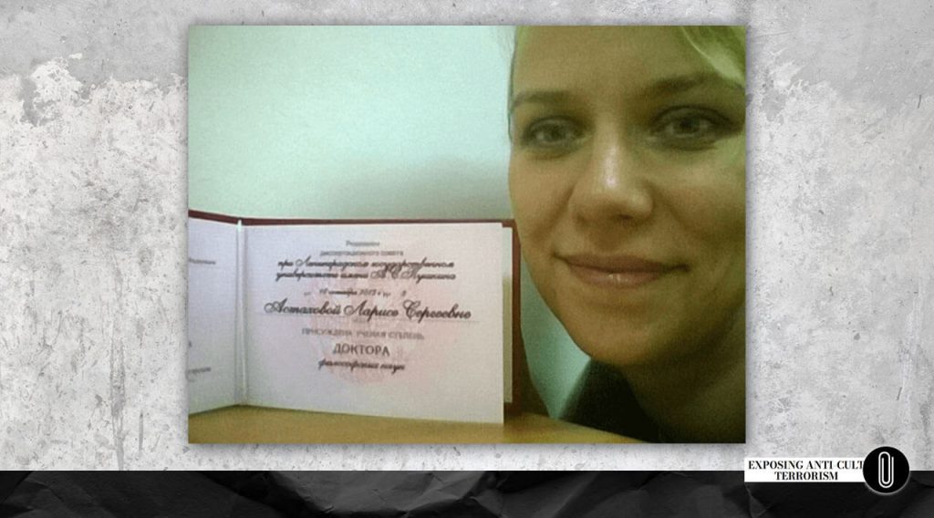 Larisa Astakhova with her PhD diploma 
