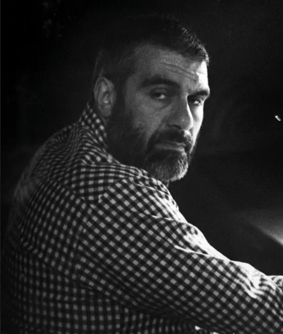 Sergei Dovlatov at the writing desk in his New York apartment. New York City, USA, 1983. Photo by Nina Alovert (illustration from Nina Alovert’s book “The Little-Known Dovlatov: Collection.” St. Petersburg: AOZT “Zvezda Magazine,” 1999. 11. Sergei Donatovich Dovlatov (14) died suddenly at the age of 48 from heart failure on August 24, 1990, in New York City.